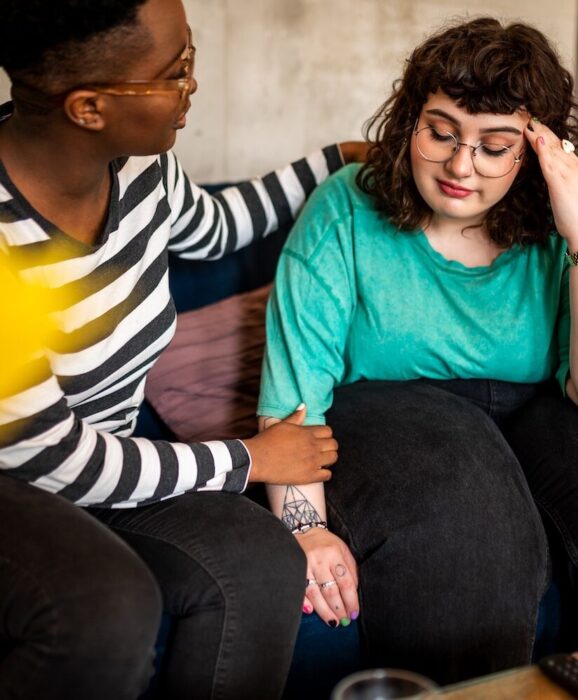 A friend comforting another person aspect ratio 303 367