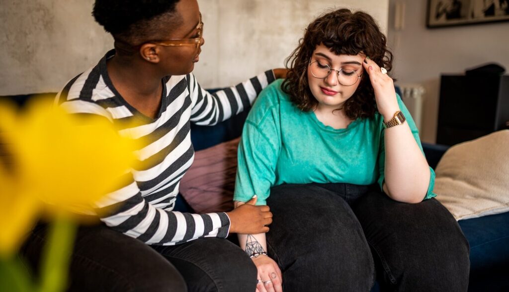 A friend comforting another person