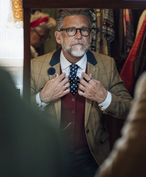Older Gentleman with Costume in Mirror aspect ratio 303 367 2