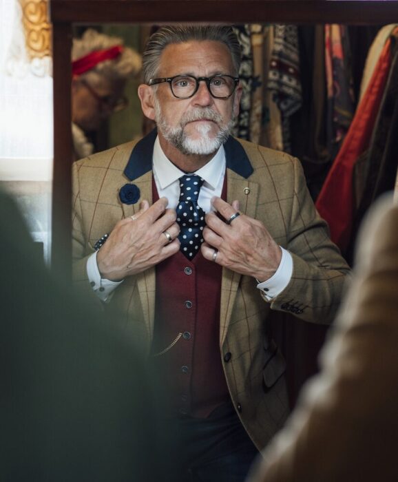 Older Gentleman with Costume in Mirror aspect ratio 303 367 3