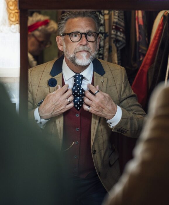 Older Gentleman with Costume in Mirror aspect ratio 303 367 4