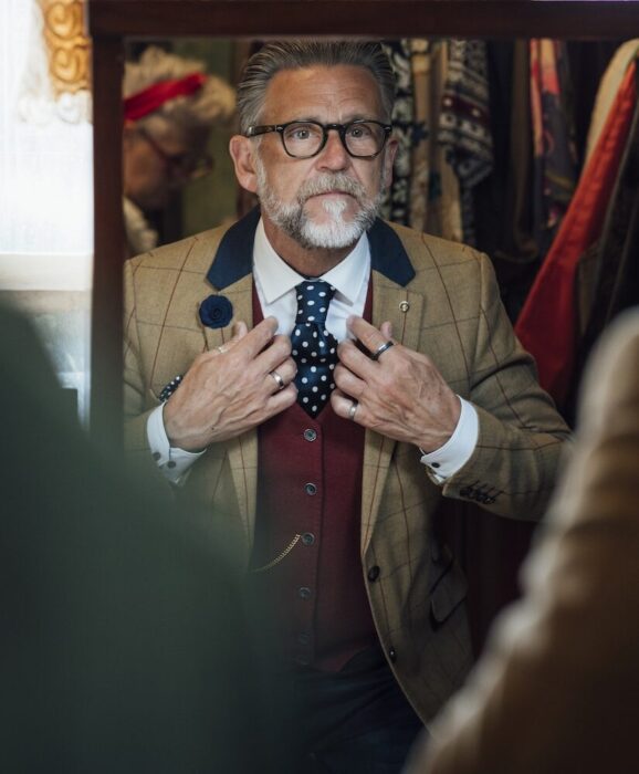 Older Gentleman with Costume in Mirror aspect ratio 303 367