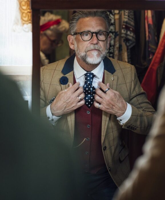 Older Gentleman with Costume in Mirror aspect ratio 303 367 6