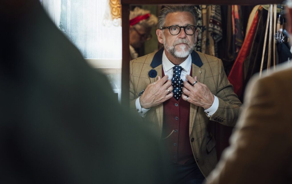 Older Gentleman with Costume in Mirror