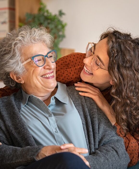 Older Lady and Younger Lady Laughing aspect ratio 303 367 1