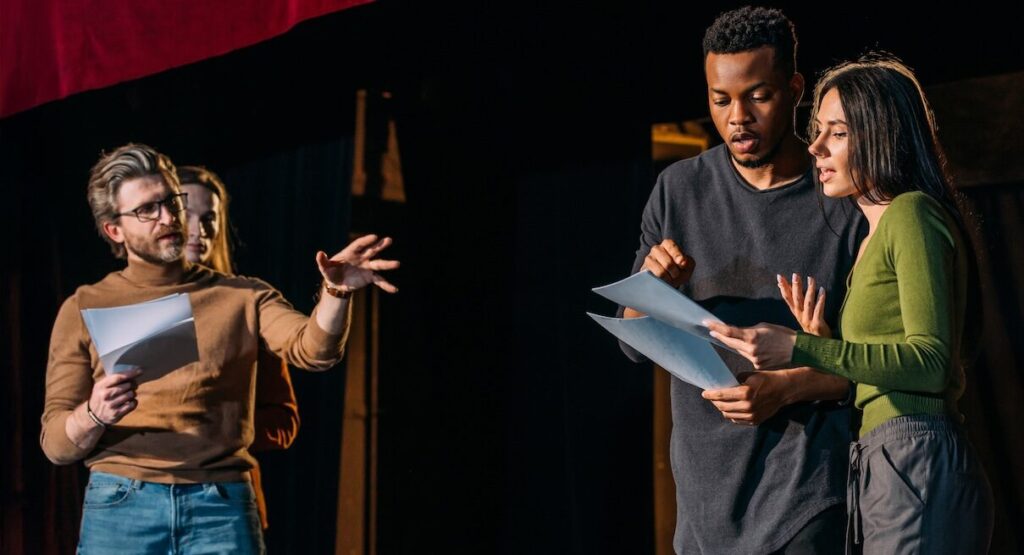 Two Actors on Stage with Director aspect ratio 850 460 1
