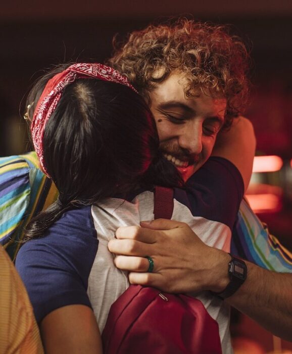 Two actors hugging aspect ratio 303 367